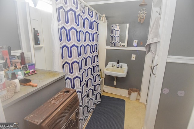 bathroom with tile patterned floors and sink