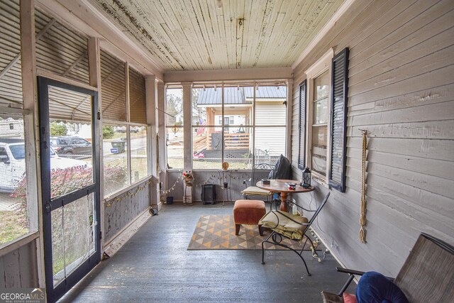 sunroom featuring wooden ceiling