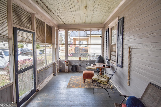 sunroom / solarium featuring wood ceiling