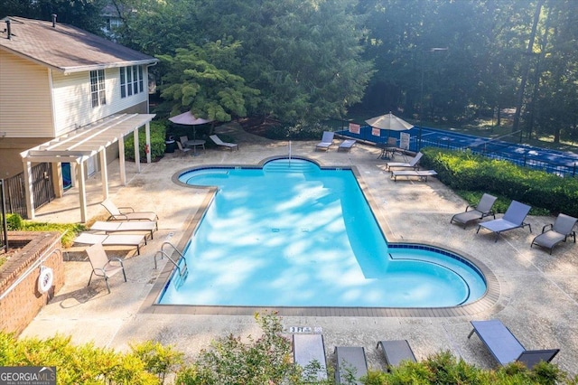 view of swimming pool featuring a patio