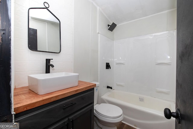 full bathroom with vanity, toilet, decorative backsplash, and bathtub / shower combination