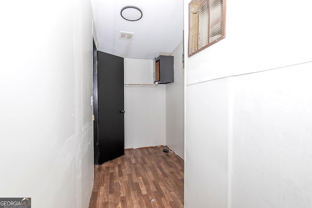 hallway featuring dark hardwood / wood-style flooring