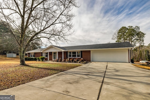 ranch-style house featuring a garage