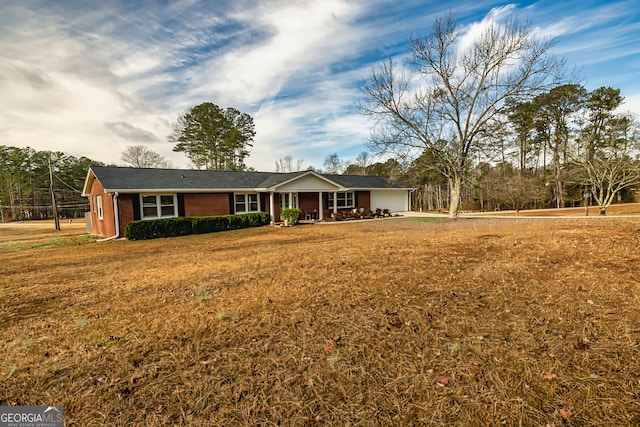 ranch-style home with a front lawn