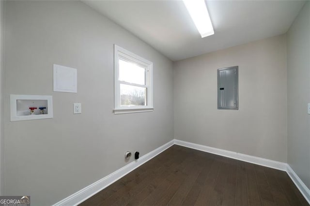 washroom featuring washer hookup, dark hardwood / wood-style flooring, and electric panel