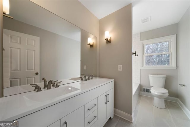 full bathroom with toilet, vanity, tile patterned floors, and shower / washtub combination