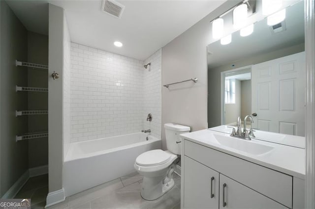 full bathroom with vanity, tiled shower / bath combo, and toilet