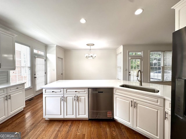 2750 Olde Towne Pkwy, Duluth, GA 30097 - kitchen with dishwasher, a sink, a chandelier, light countertops, and dark wood-style flooring