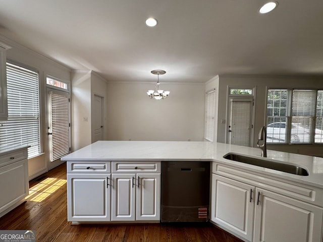 2750 Olde Towne Pkwy, Duluth, GA 30097 - kitchen with a sink, dishwashing machine, a chandelier, ornamental molding, and dark wood-style floors