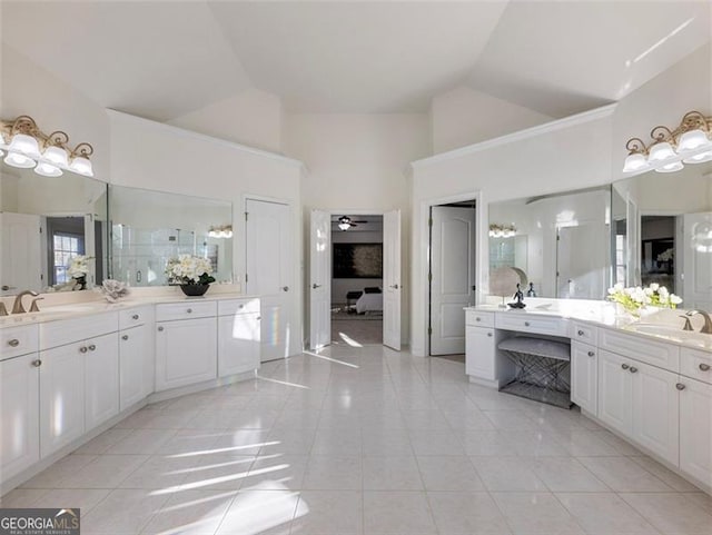 2750 Olde Towne Pkwy, Duluth, GA 30097 - bathroom featuring tile patterned flooring, high vaulted ceiling, two vanities, and a ceiling fan