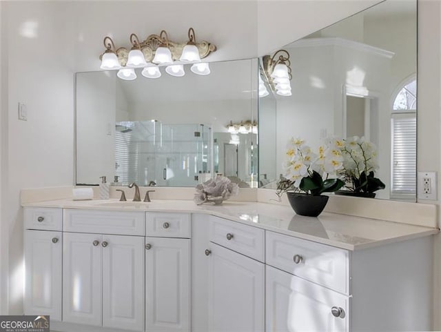 bathroom featuring vanity and a shower with shower door