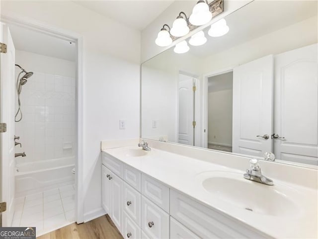 2750 Olde Towne Pkwy, Duluth, GA 30097 - full bathroom with double vanity, shower / tub combination, baseboards, and wood finished floors