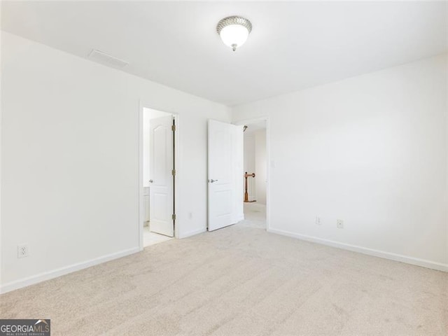 2750 Olde Towne Pkwy, Duluth, GA 30097 - unfurnished bedroom with light colored carpet, baseboards, and connected bathroom