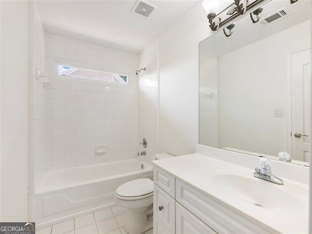 full bathroom featuring toilet, vanity, tile patterned floors, and tiled shower / bath