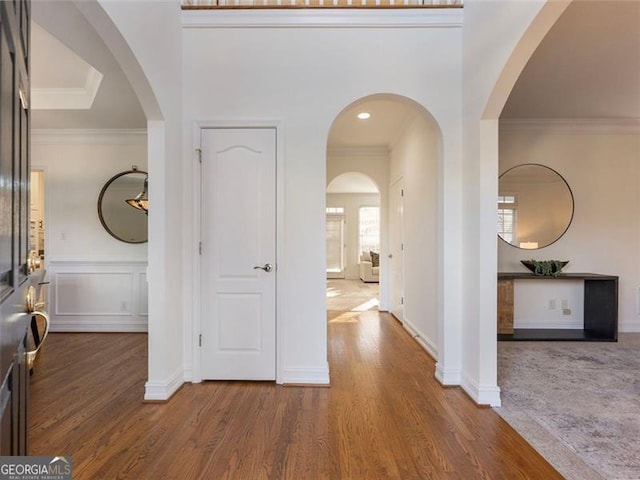 entrance foyer featuring hardwood / wood-style floors and ornamental molding