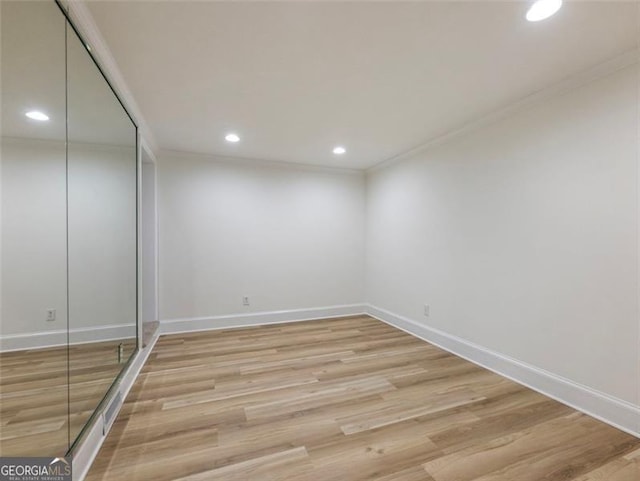 interior space with light hardwood / wood-style floors and ornamental molding