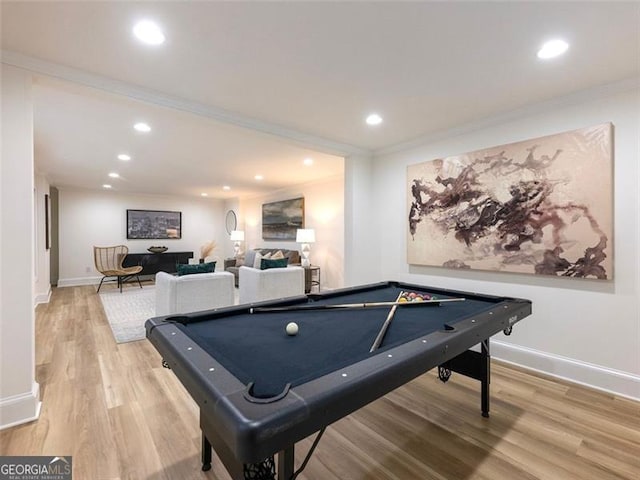 recreation room with light wood-type flooring, ornamental molding, and billiards