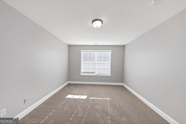 spare room featuring carpet floors