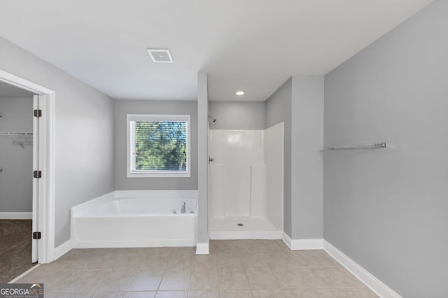 bathroom with shower with separate bathtub