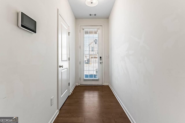 doorway to outside with dark hardwood / wood-style floors