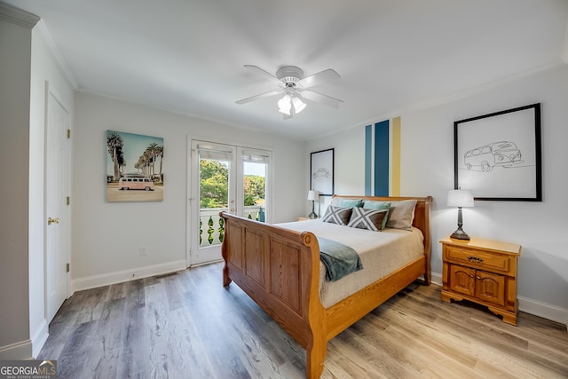 bedroom with light hardwood / wood-style floors, ceiling fan, access to outside, french doors, and ornamental molding