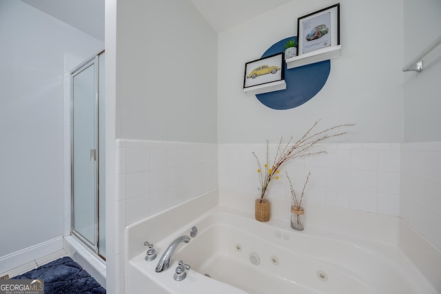 bathroom featuring independent shower and bath and tile patterned flooring