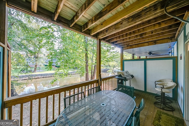 wooden deck featuring a grill