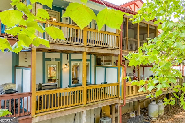 rear view of property featuring central AC unit