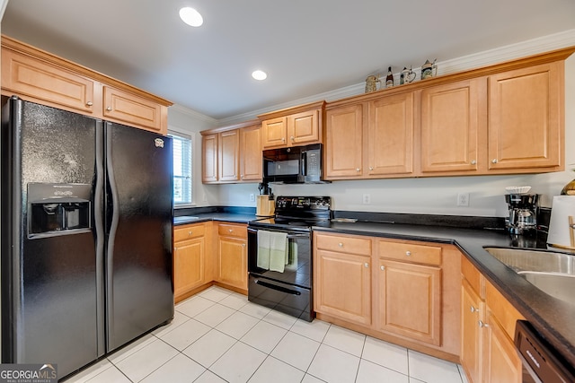 kitchen featuring light tile patterned floors, ornamental molding, sink, and black appliances