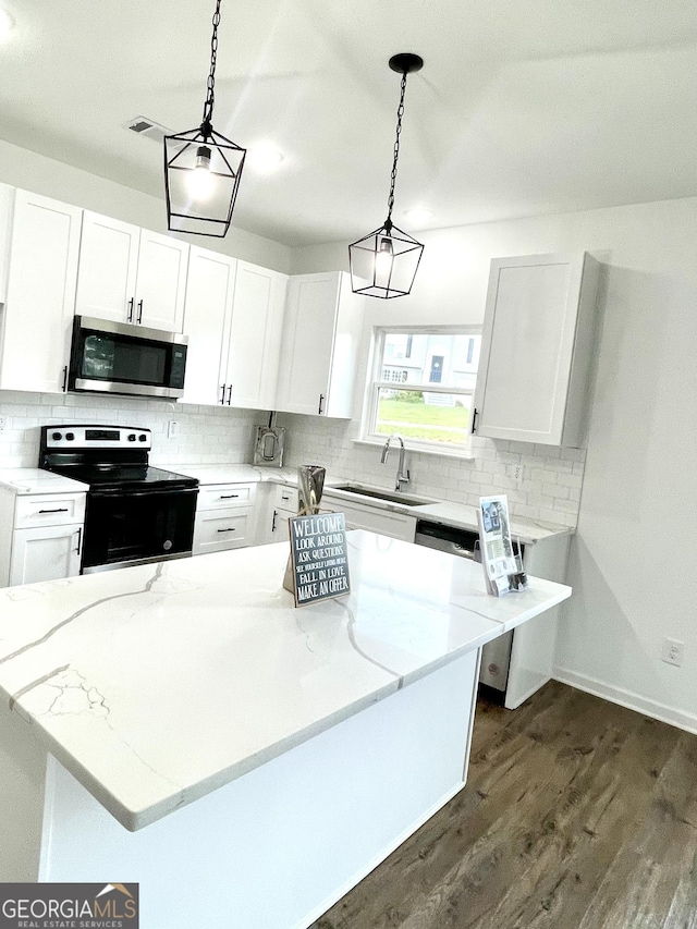 kitchen with white cabinetry, sink, and appliances with stainless steel finishes