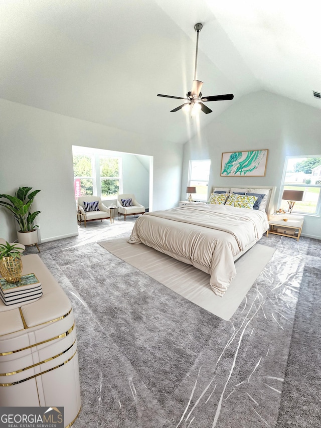 bedroom featuring carpet, ceiling fan, and vaulted ceiling