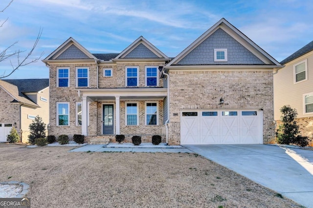 view of front of home featuring covered porch and a garage