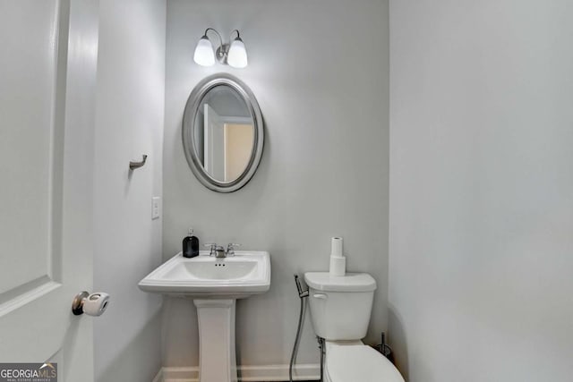 bathroom with sink and toilet