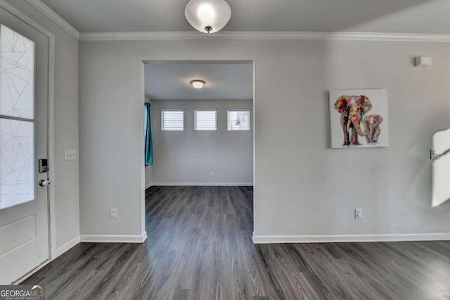 foyer with crown molding and dark hardwood / wood-style flooring