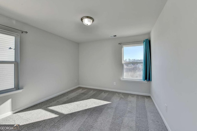 unfurnished room with carpet floors