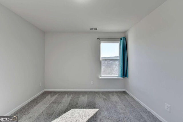 empty room with carpet flooring