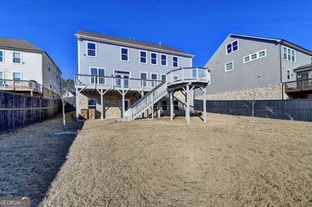 back of house featuring a deck