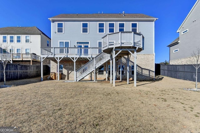 back of house featuring a deck