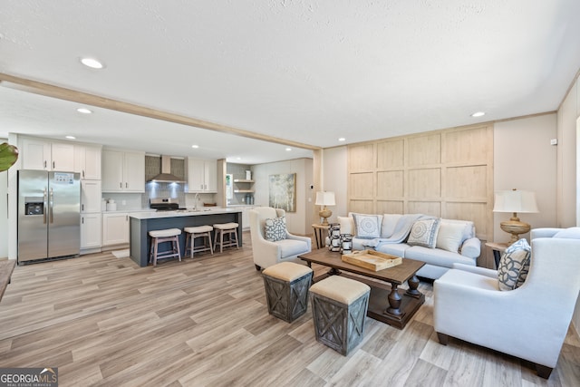 living room with light hardwood / wood-style flooring