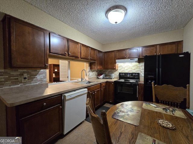 kitchen with tasteful backsplash, light tile patterned flooring, dark brown cabinets, black appliances, and sink