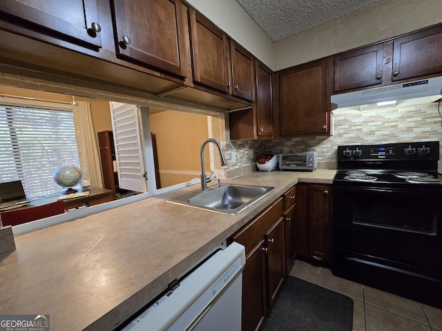 kitchen with black range with electric cooktop, sink, light tile patterned flooring, white dishwasher, and dark brown cabinets