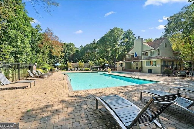 view of swimming pool featuring a patio