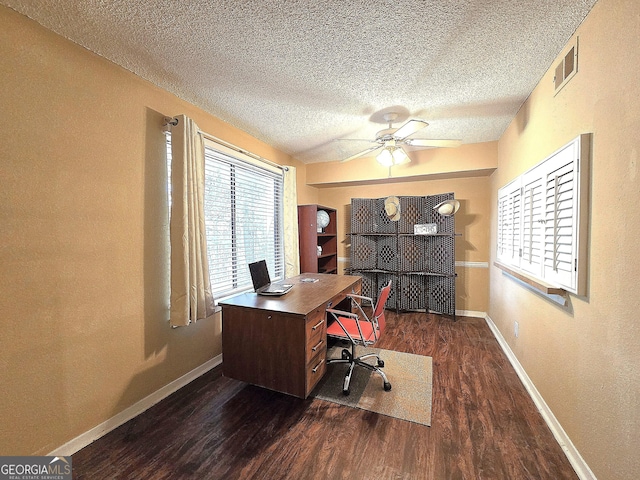 office featuring ceiling fan, dark hardwood / wood-style flooring, and a textured ceiling