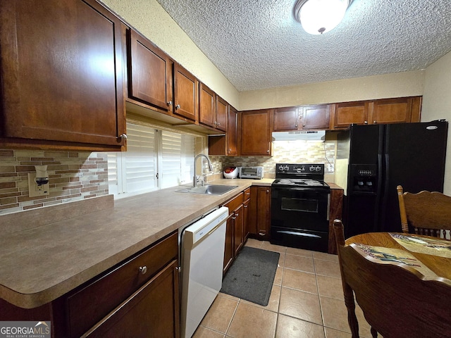 kitchen featuring black appliances, light tile patterned floors, backsplash, and sink