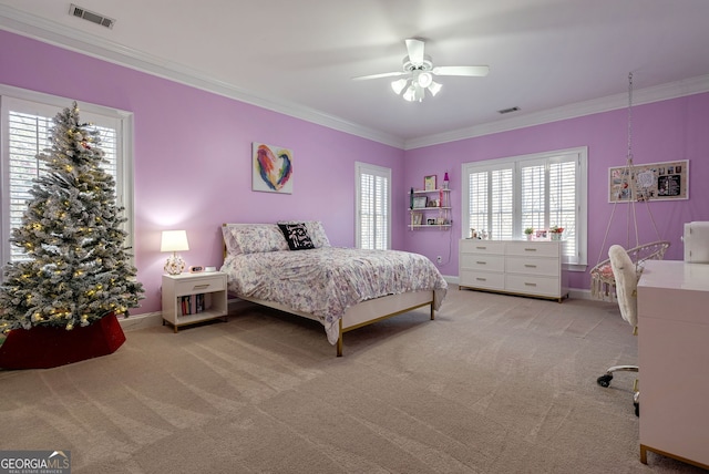 bedroom featuring light carpet, ceiling fan, and crown molding