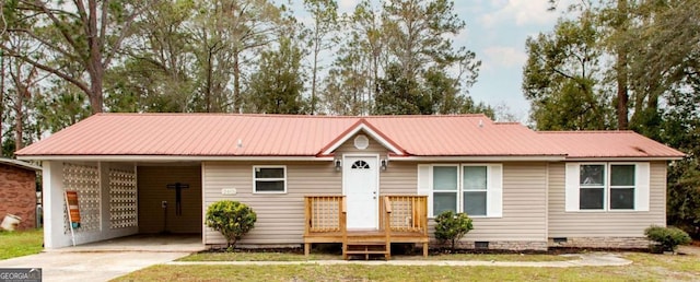 ranch-style home featuring a front yard and a carport