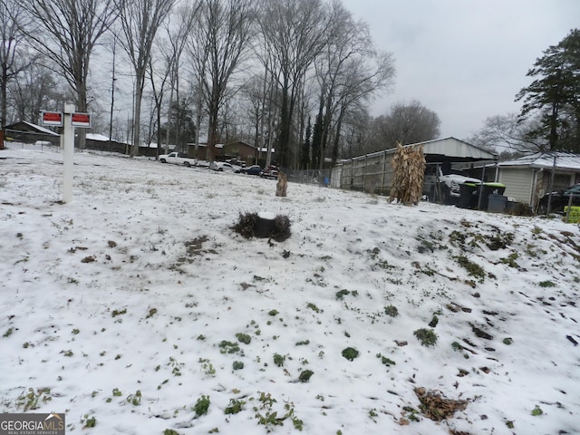 view of yard layered in snow