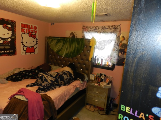 bedroom featuring a textured ceiling