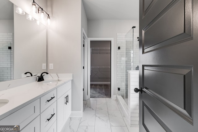 bathroom featuring vanity and tiled shower