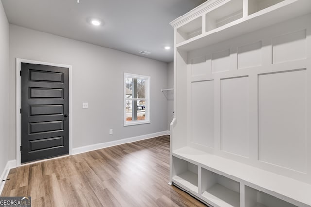 mudroom featuring wood-type flooring